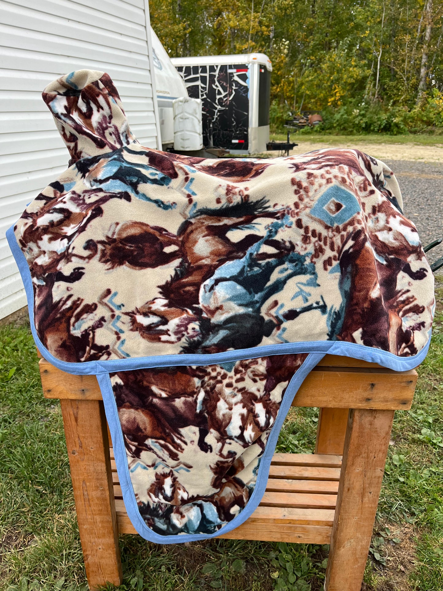 Cream brown blue horse print western fleece full coverage saddle cover with fenders, horn, & stirrup pockets