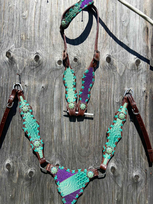 Teal purple gladiator tack set fits larger horses best, you’d need to cut, or replace tugs to fit the smaller guys.