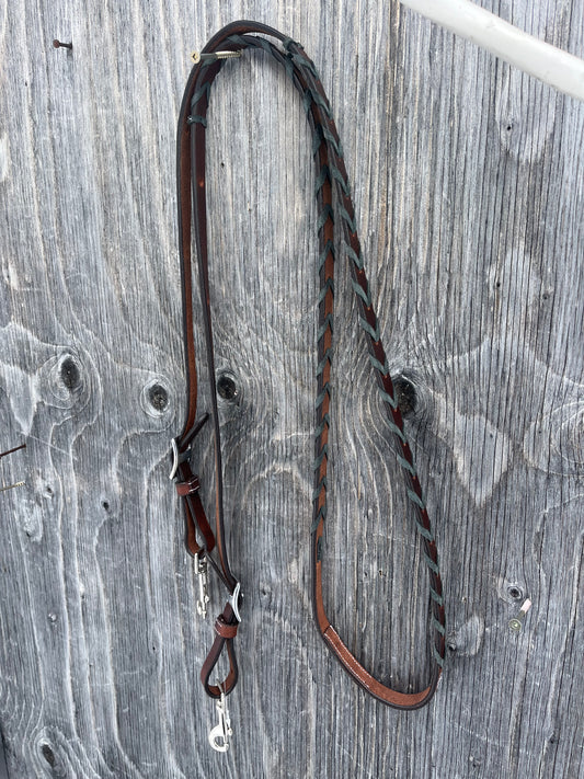 Grey/ black laced adjustable barrel reins 7’10 at longest point with 6 holes/ side to adjust