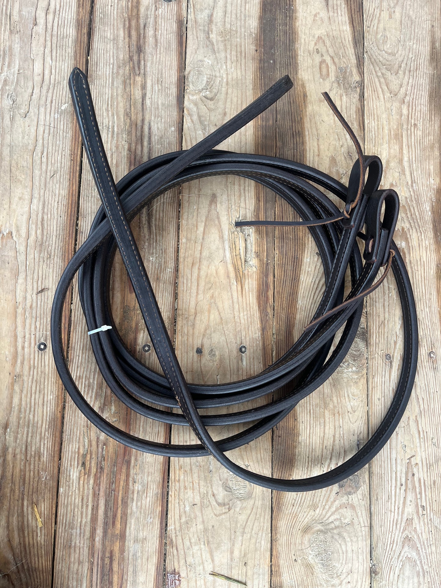 Supple thick leather weighted split reins dark oil