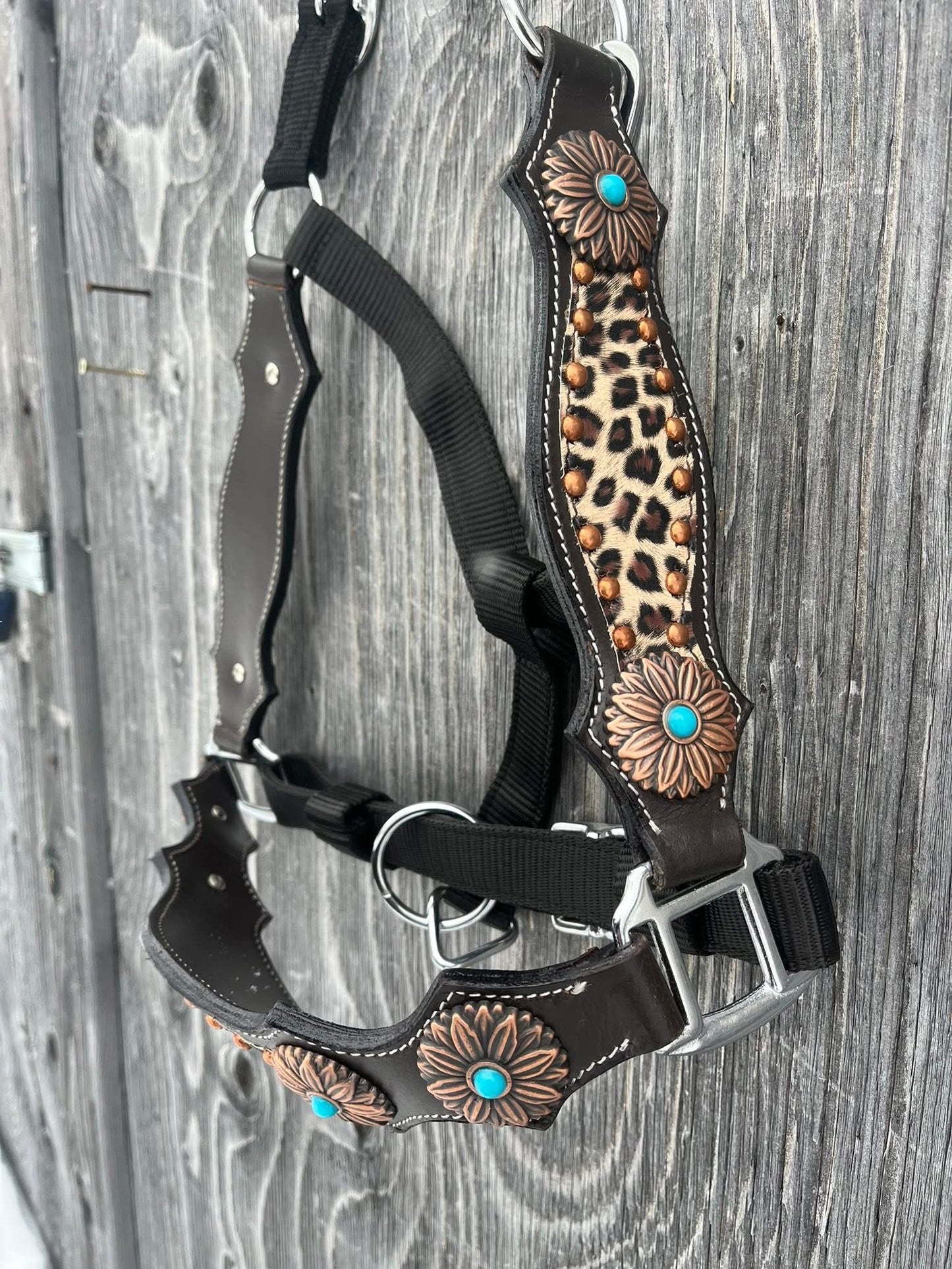 Cheetah bronc halter with leather nose and cheeks, copper flower conchos with turquoise stone centres, cheetah inlay and copper spots
