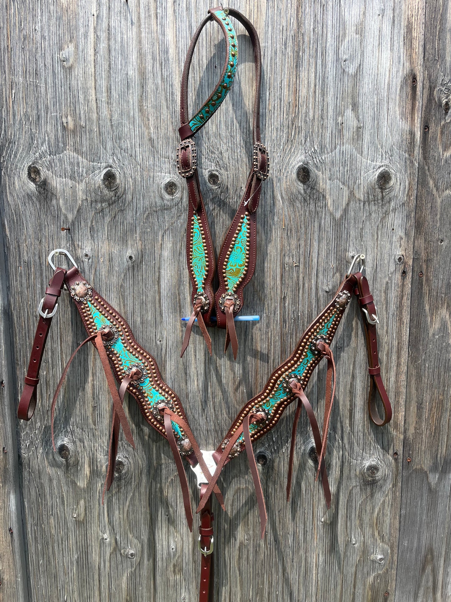 Teal copper tack set with leather tassels