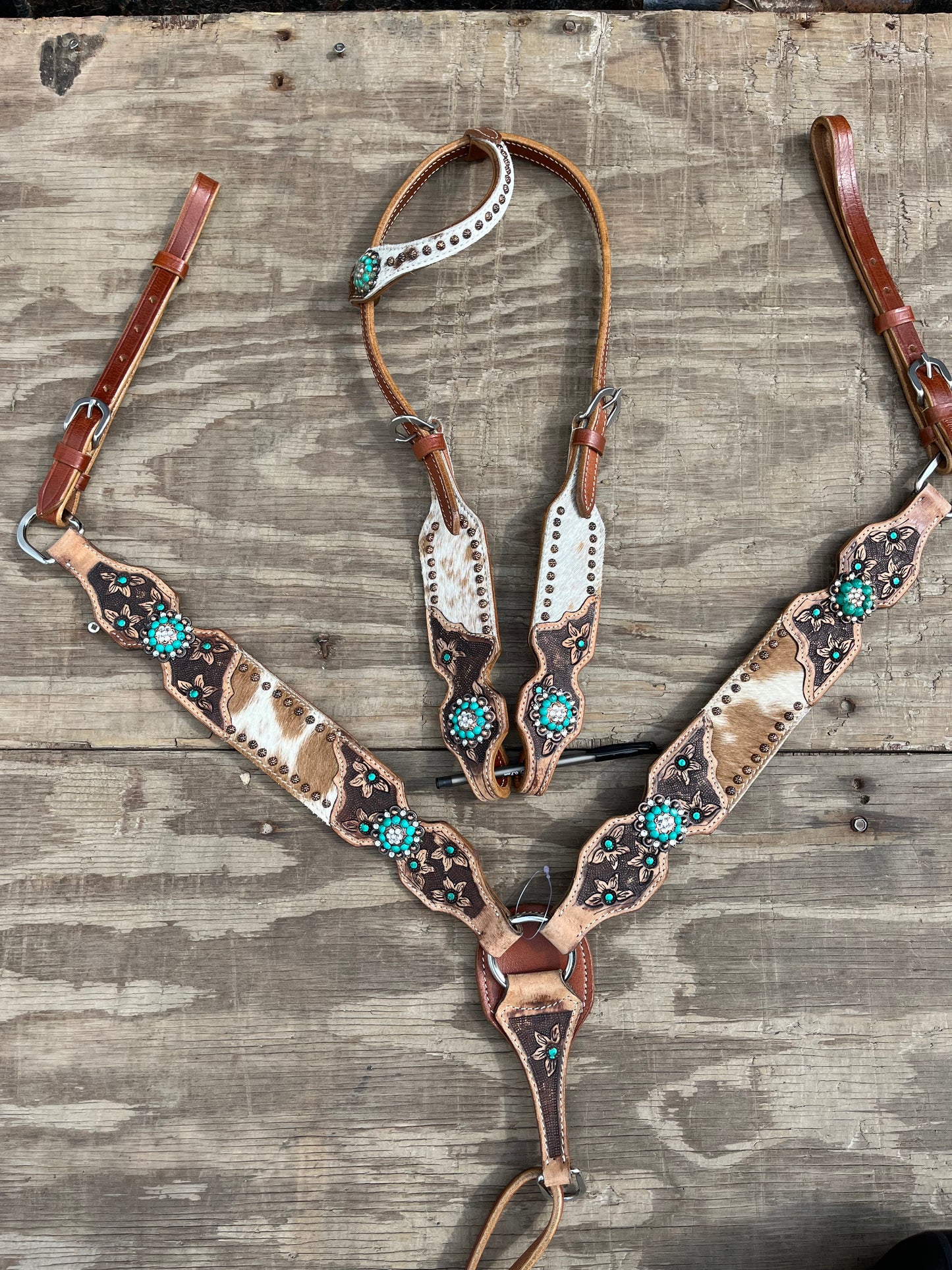 Hair on cowhide tack set with teal accents