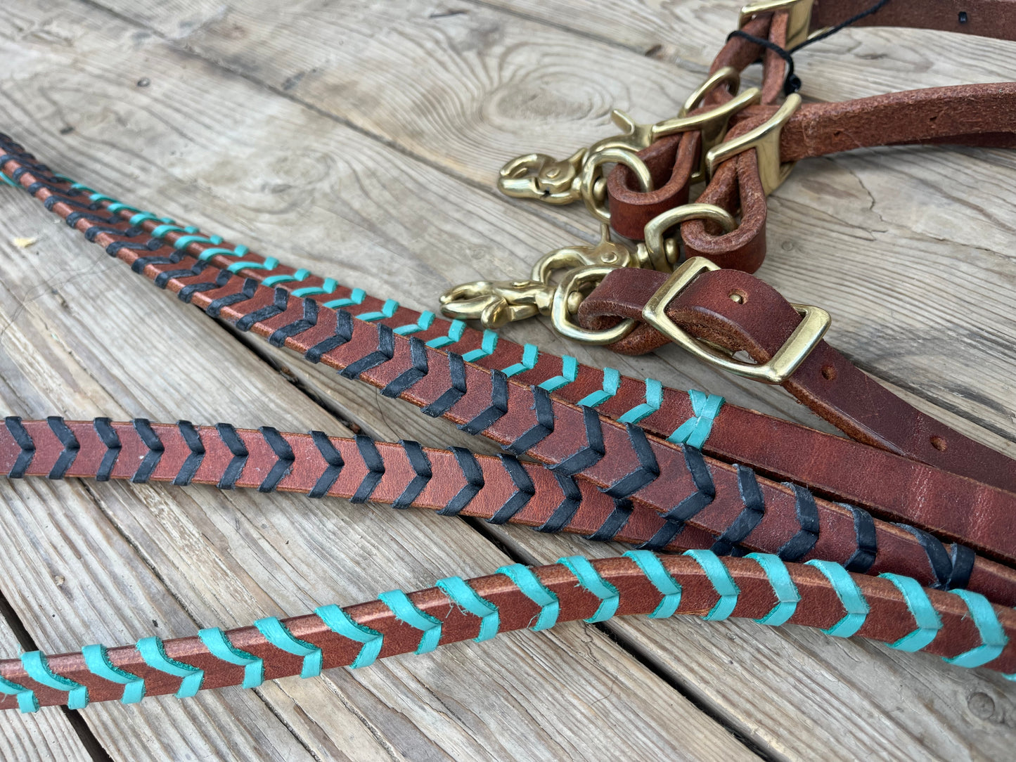 Colored lace harness leather barrel reins with adjustable length and quick change brass hardware snaps