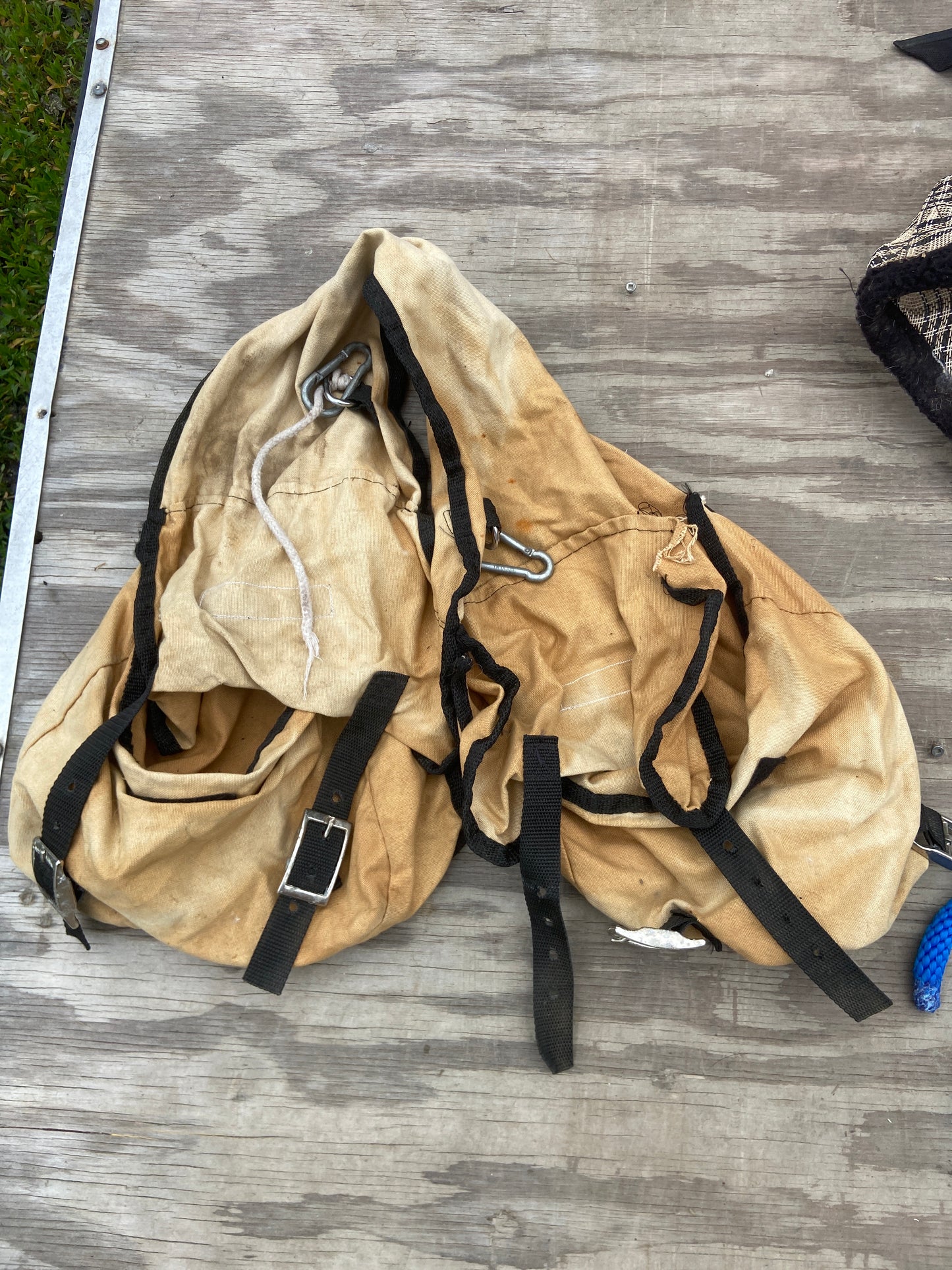 Older double saddle bag has rip