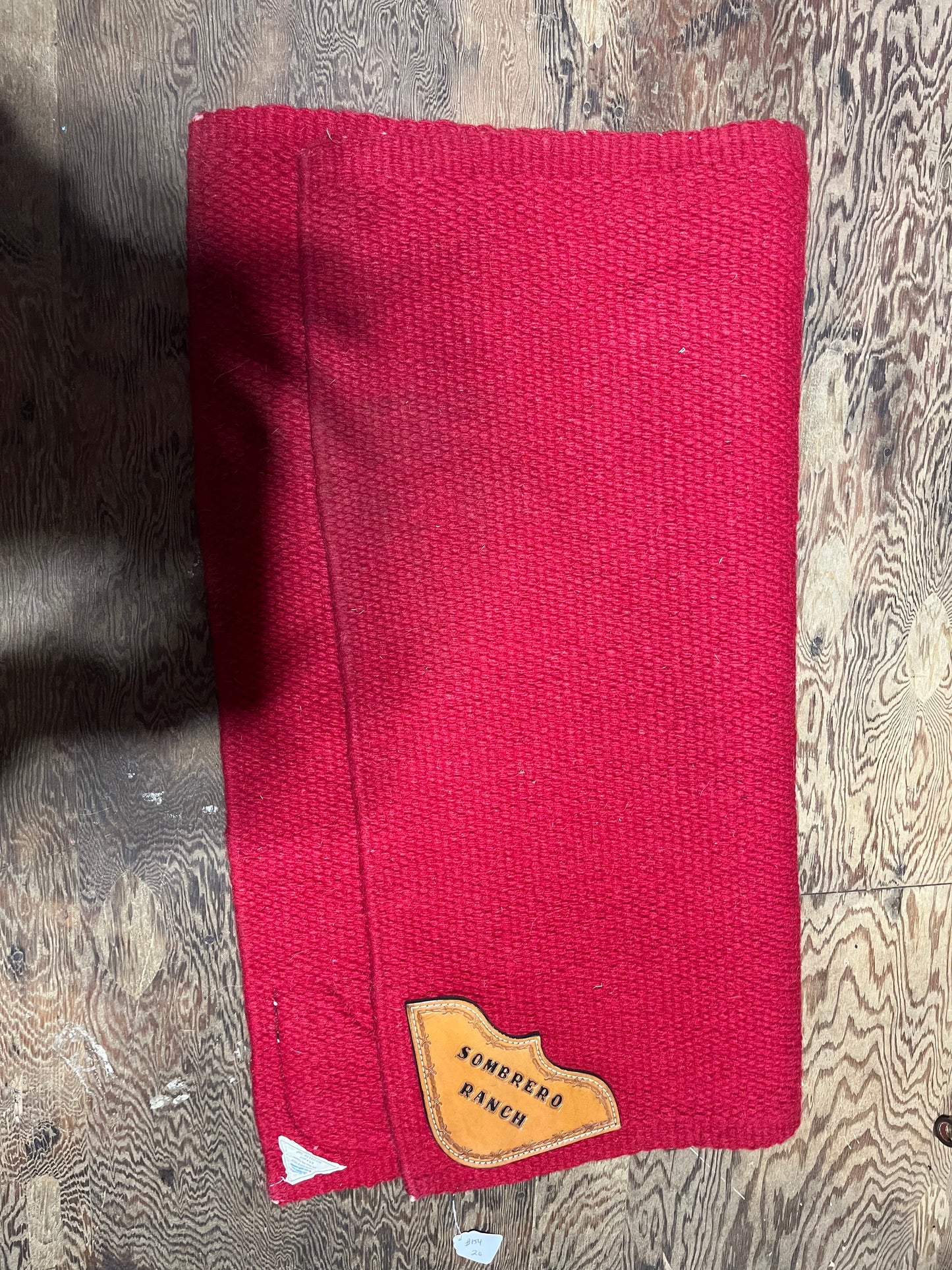 Embroidered red wool saddle blanket