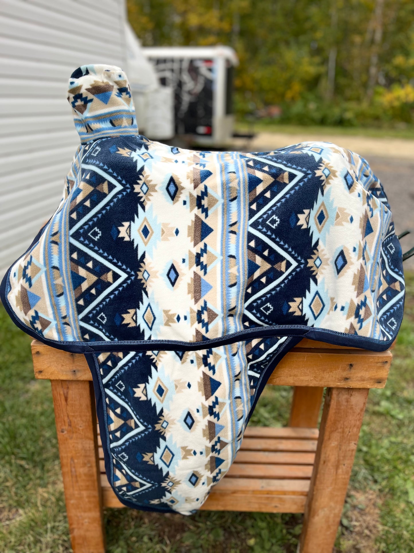 Navajo cream blue print western fleece full coverage saddle cover with fenders, horn, & stirrup pockets