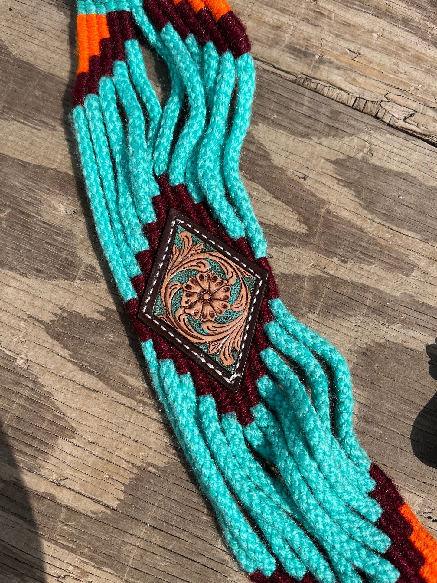 Teal and orange tack set with leather accents