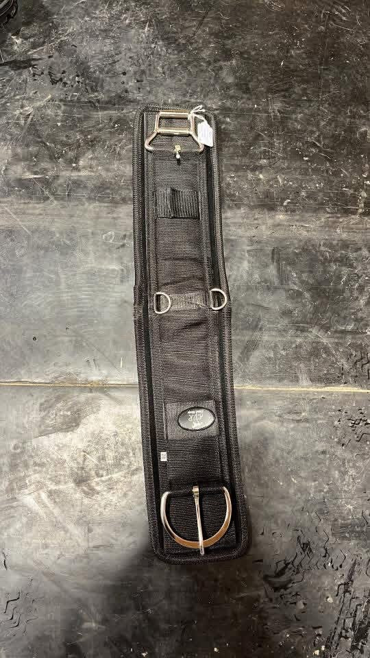 Western cinch with removable backing and roller buckle