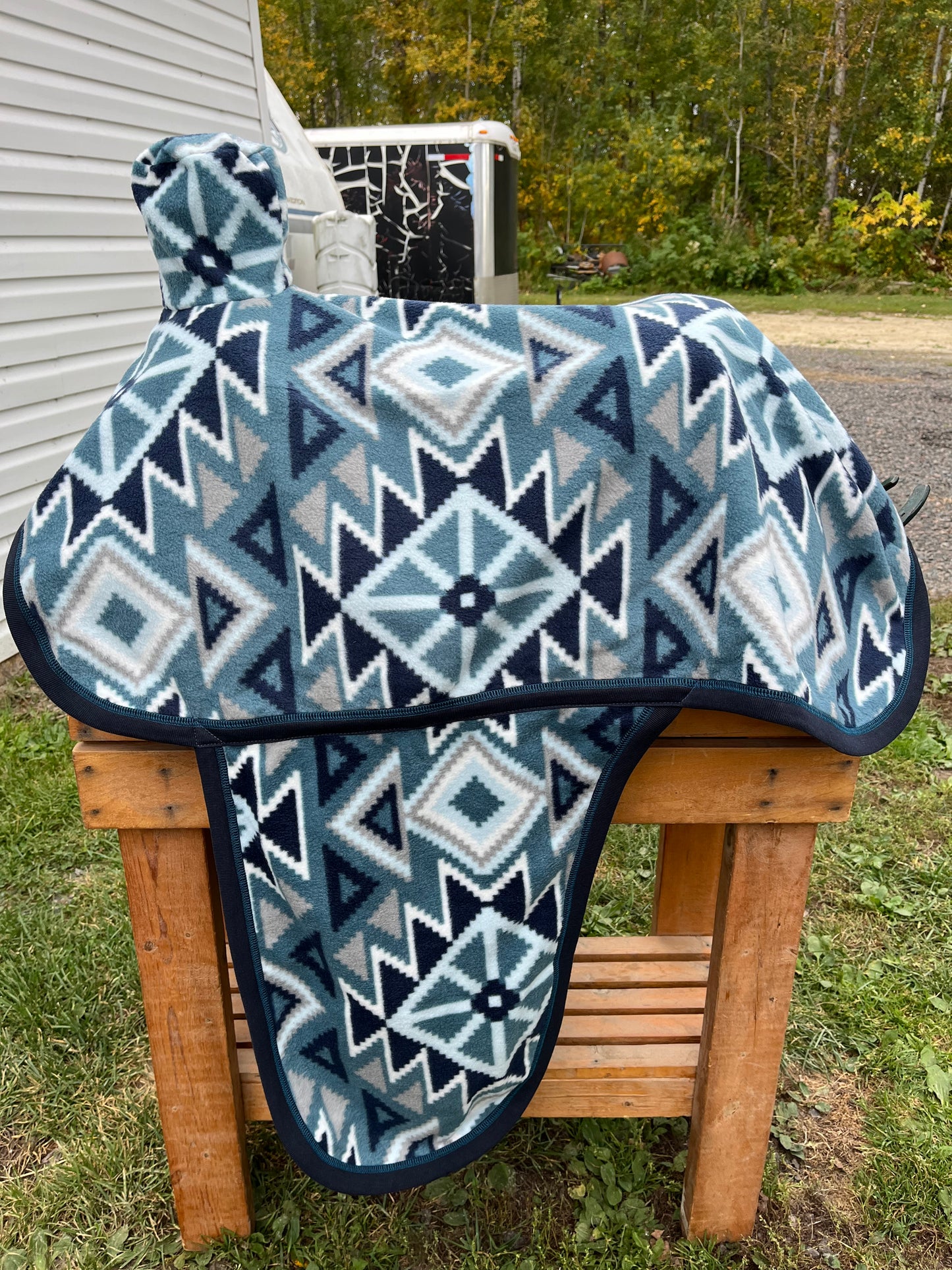 Blue Aztec horse print western fleece full coverage saddle cover with fenders, horn, & stirrup pockets