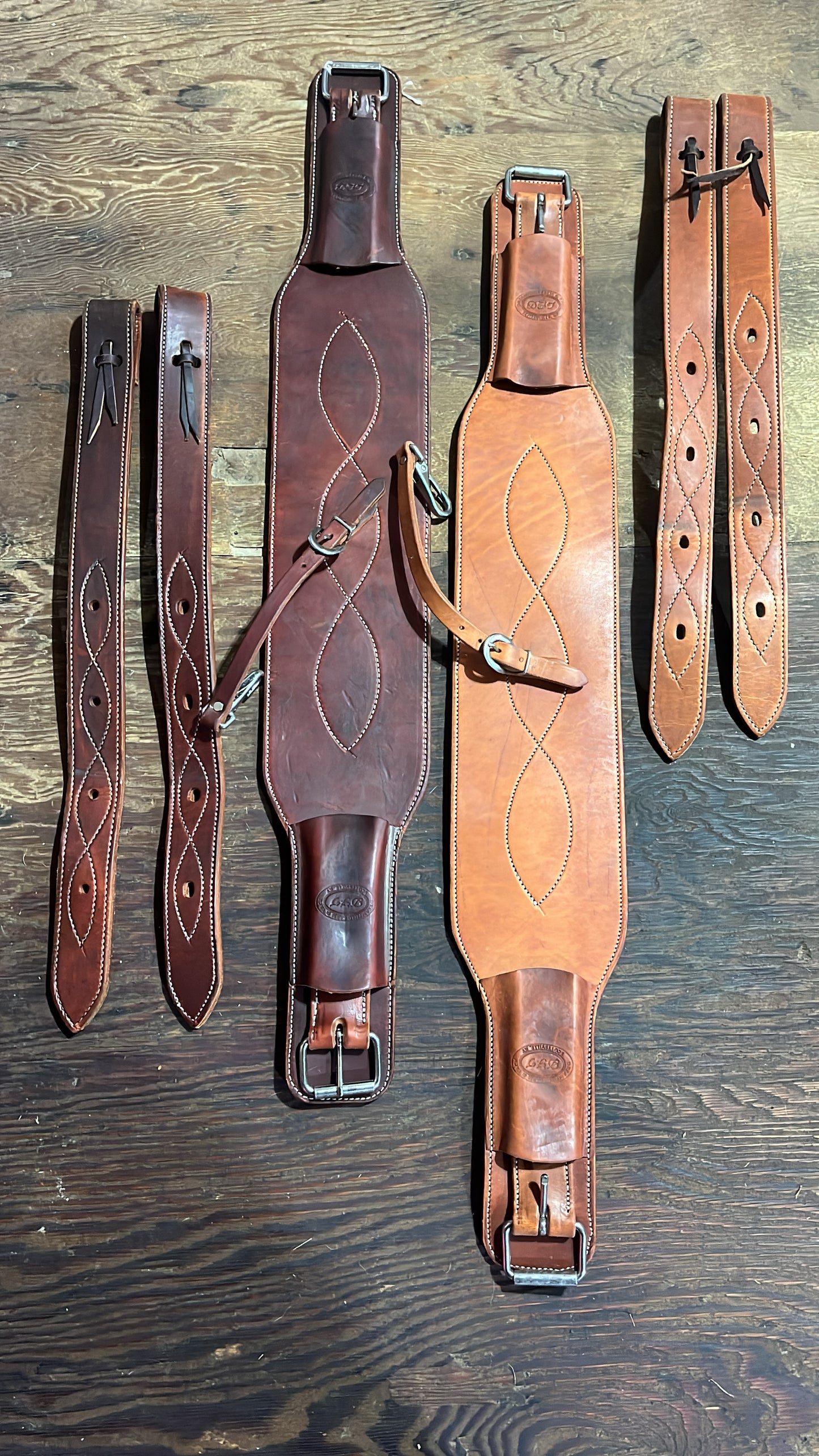 Heavy duty thick quality leather double roller buckle fancy stitched rear cinch sets with matching off billets, connector strap & latigo and off billet pockets.