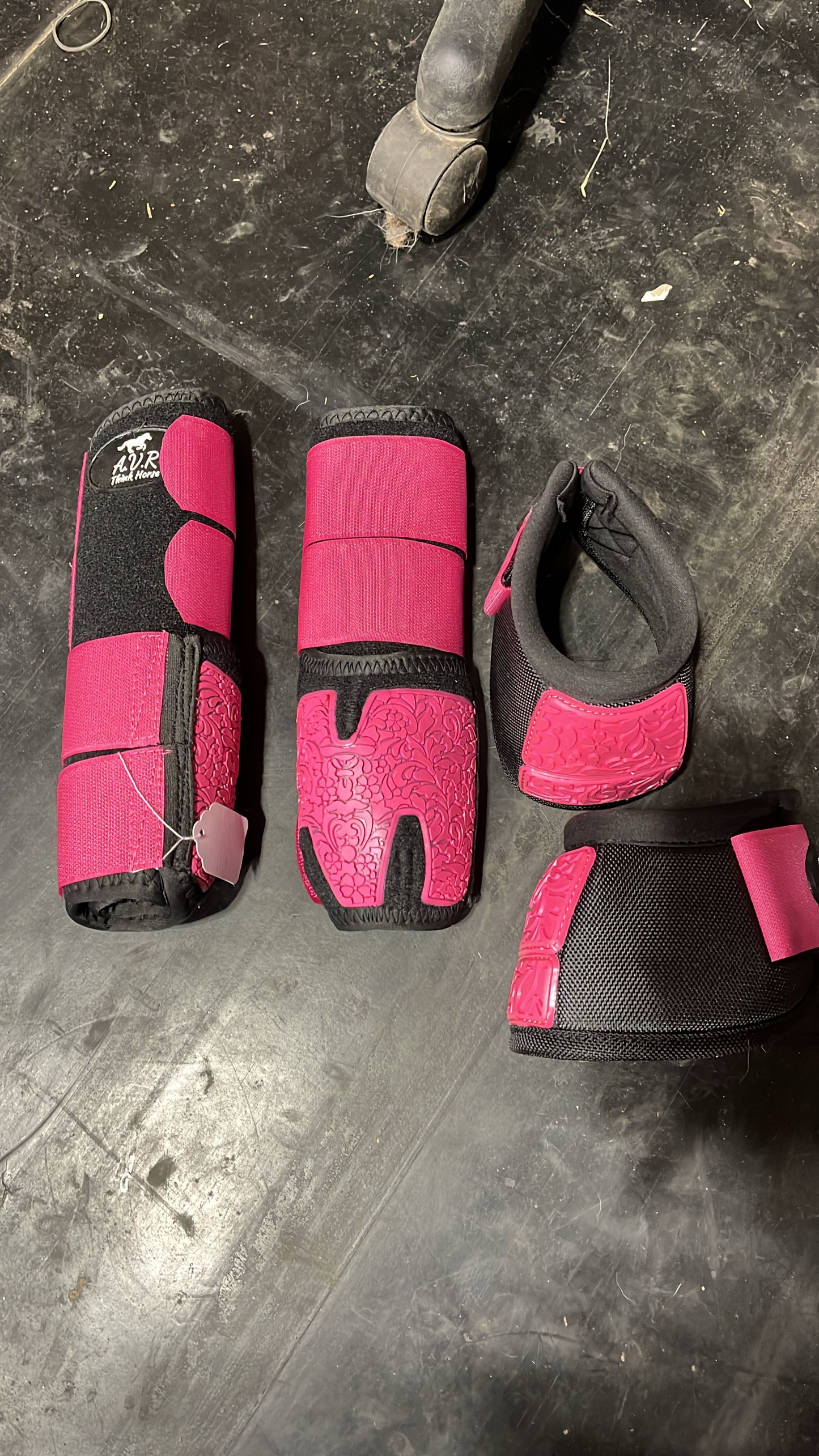 Pink and black sport boots with bell boots