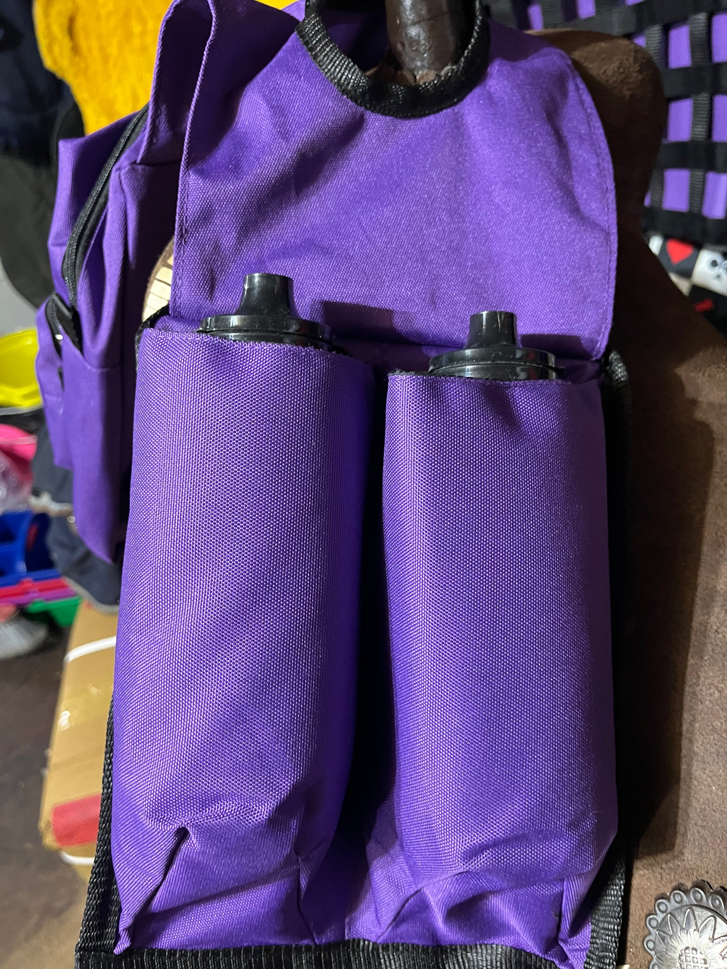 Purple horn bag with water bottles