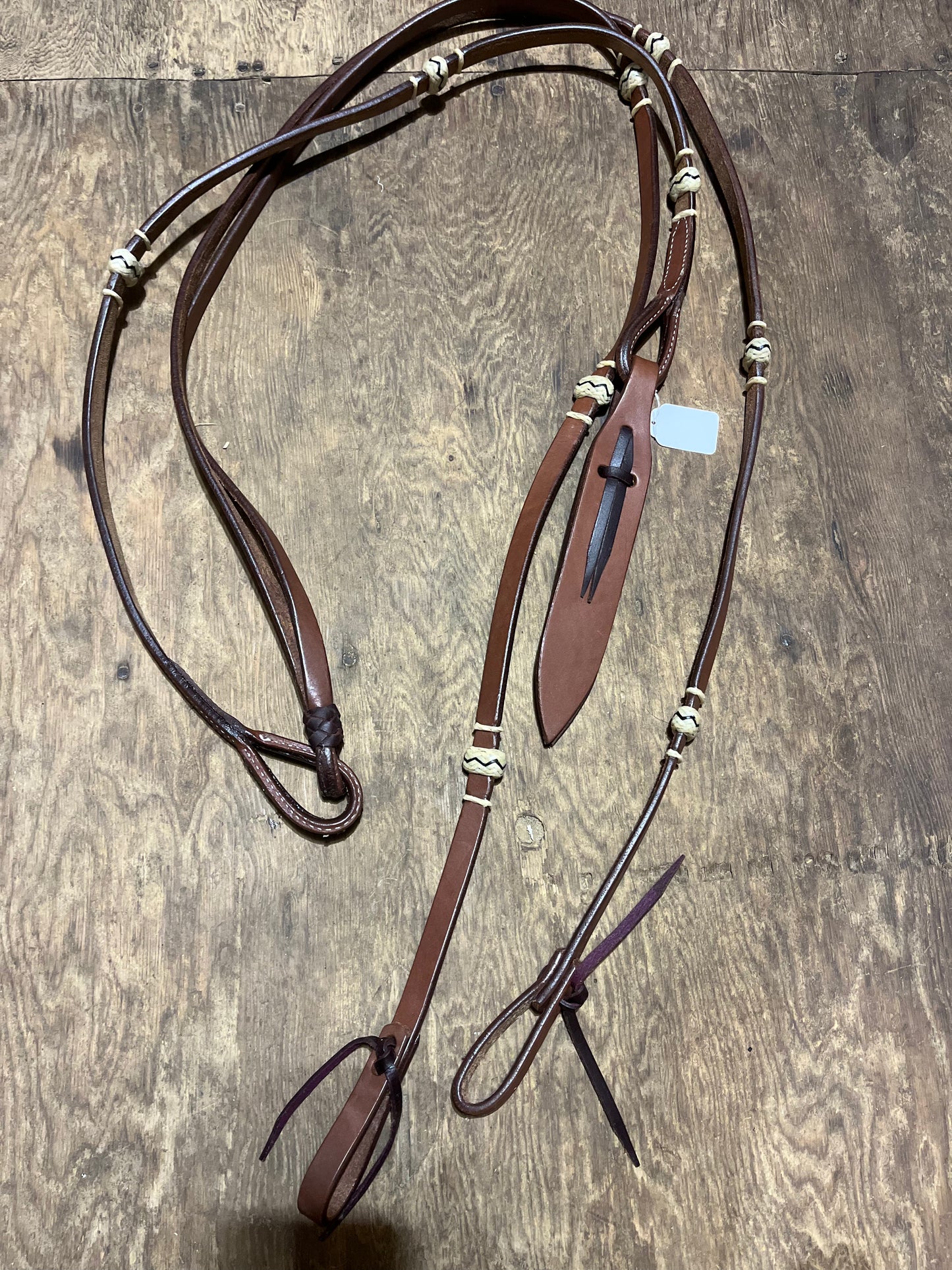 Leather romal reins with rawhide accents
