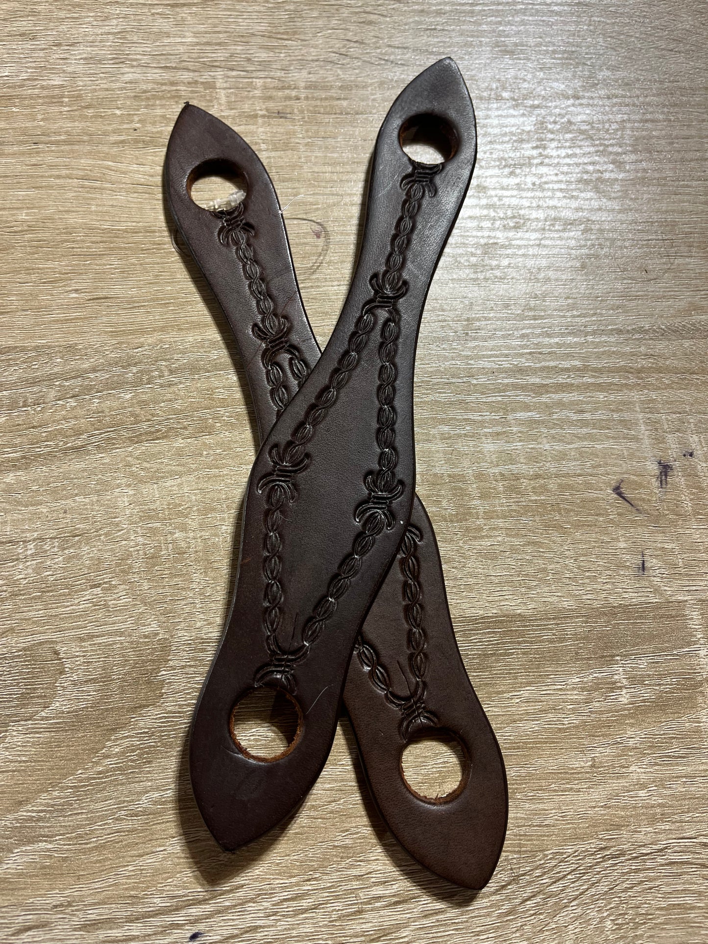 Dark oil barbwire tooled slobber straps
