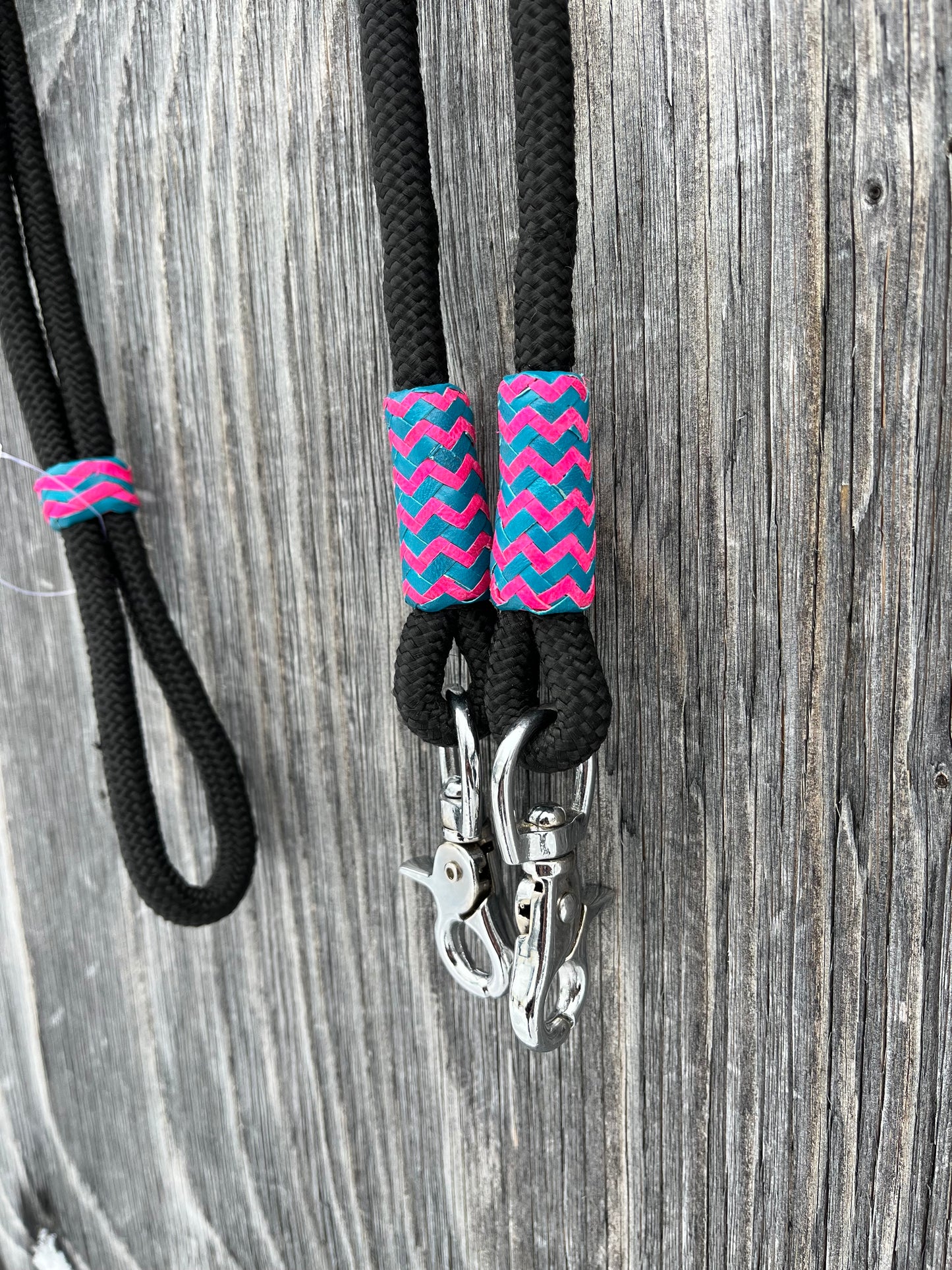 Roping reins with pink and turquoise rawhide accents with snaps
