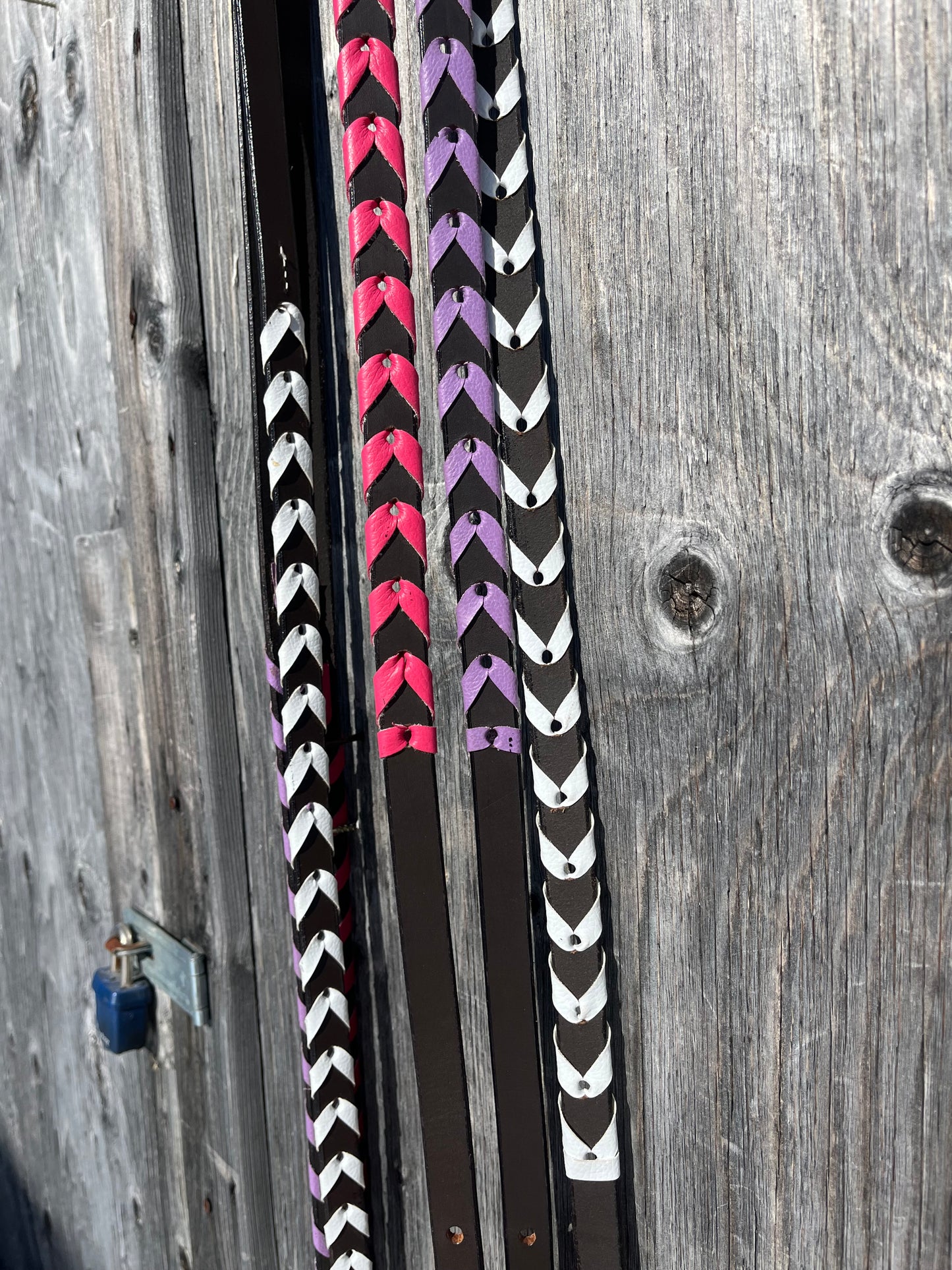 Colorful laced adjustable leather reins, 9ft6 at longest hole with 8 holes per side to adjust