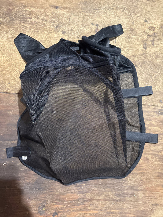 Riding fly mask hooks to bridle with ears