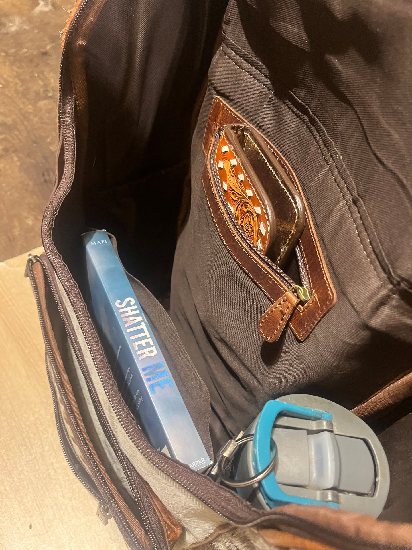 Hair on cowhide backpack