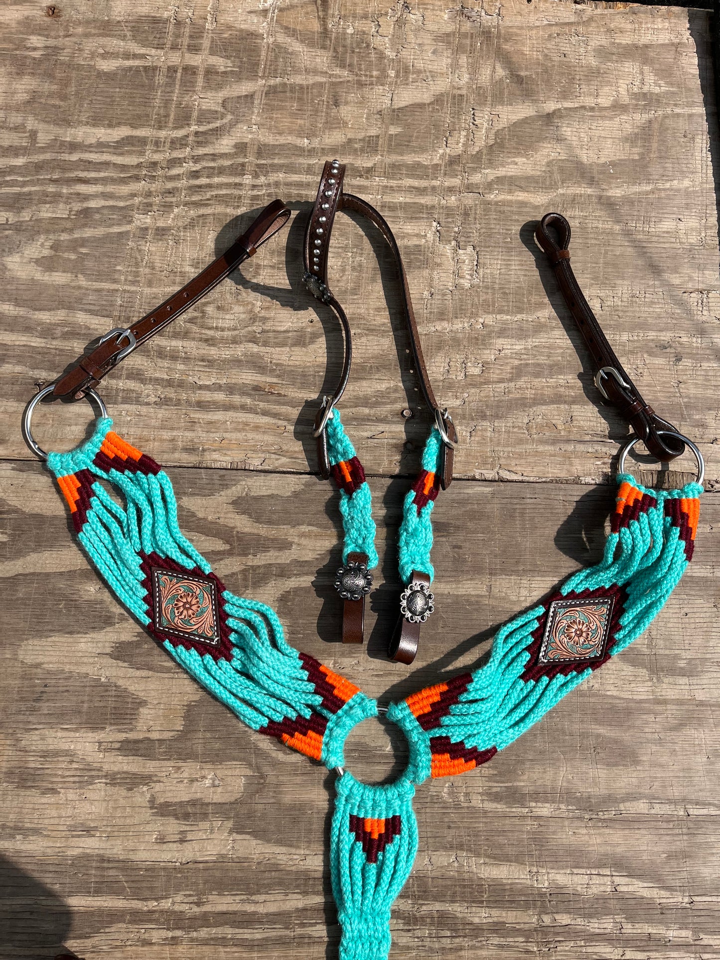 Teal and orange tack set with leather accents