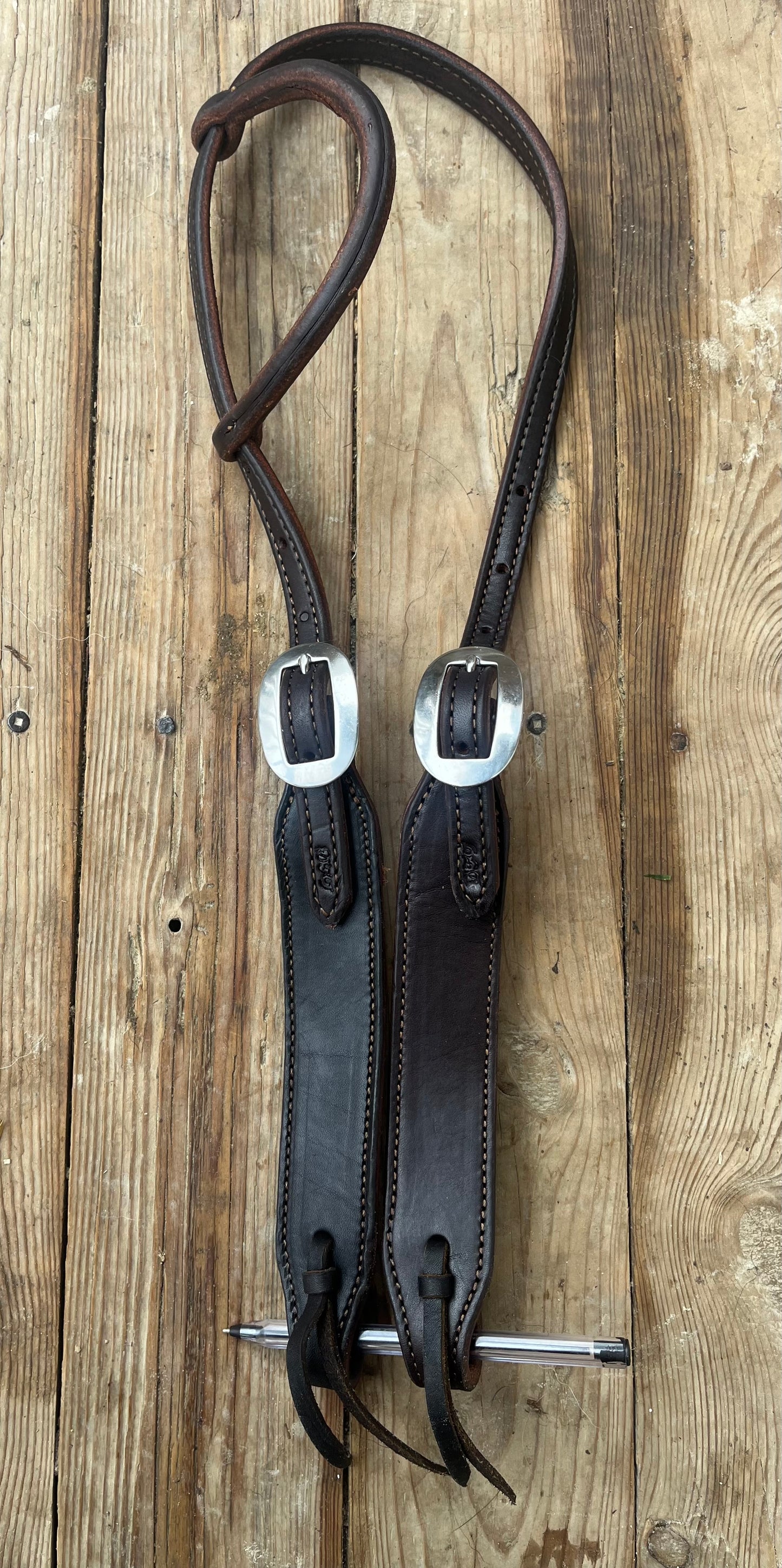 Supple leather rolled one ear tie ends