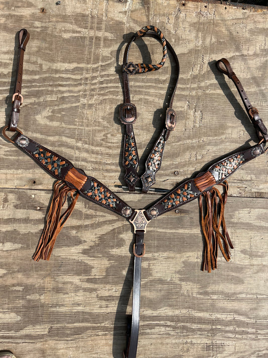 One ear tack set with copper fringe accents