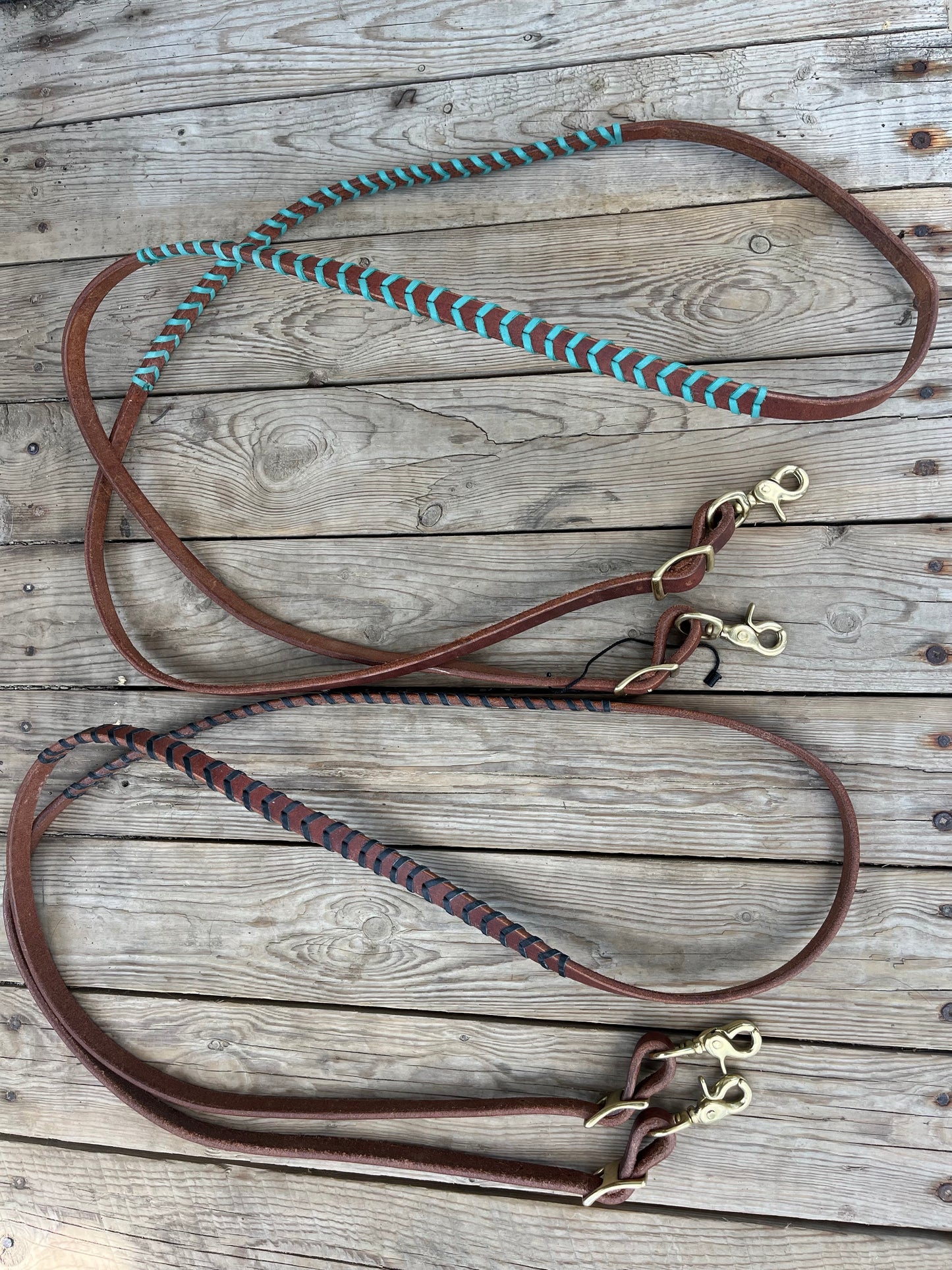 Colored lace harness leather barrel reins with adjustable length and quick change brass hardware snaps