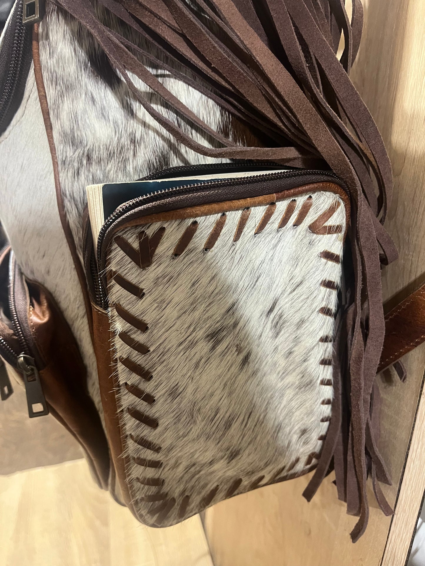 Hair on cowhide backpack