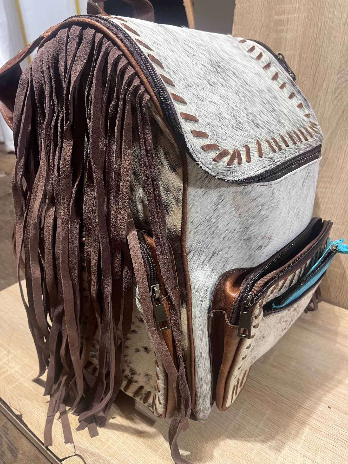 Hair on cowhide backpack
