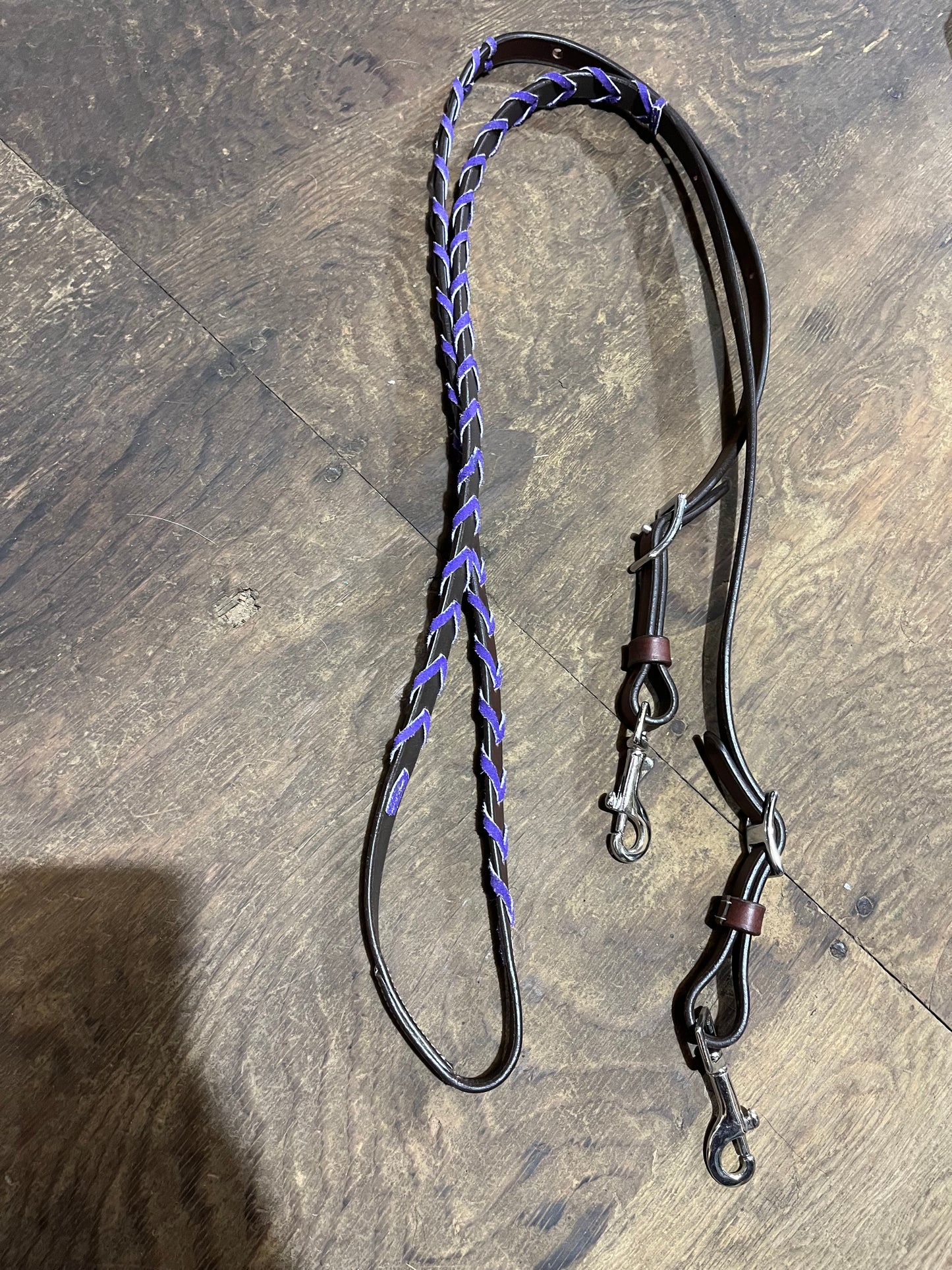Purple laced dark leather adjustable barrel reins with snaps