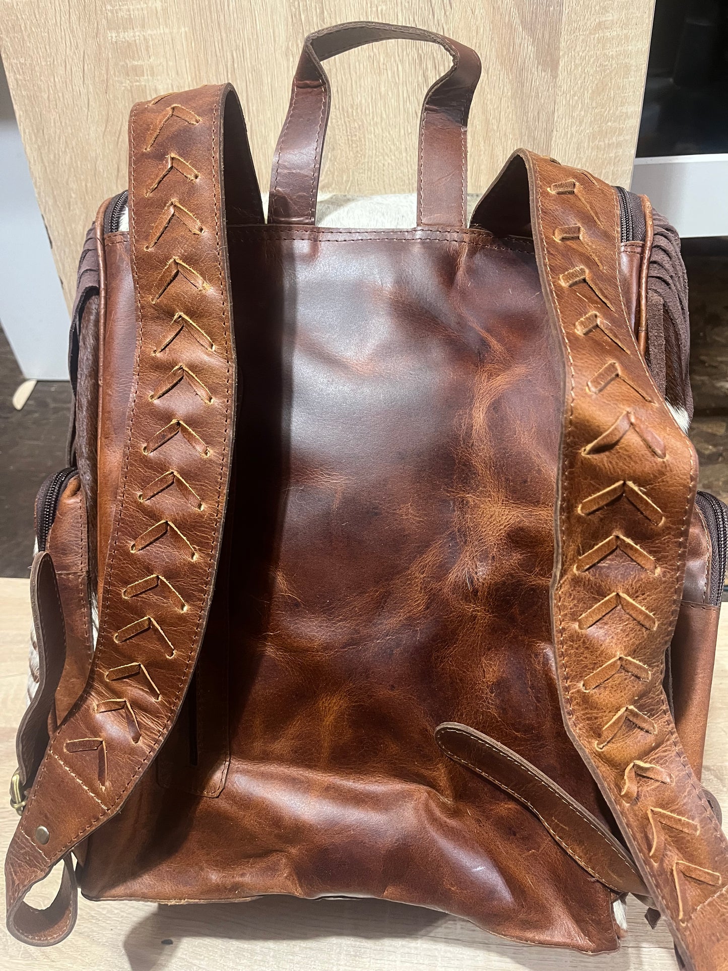 Hair on cowhide backpack