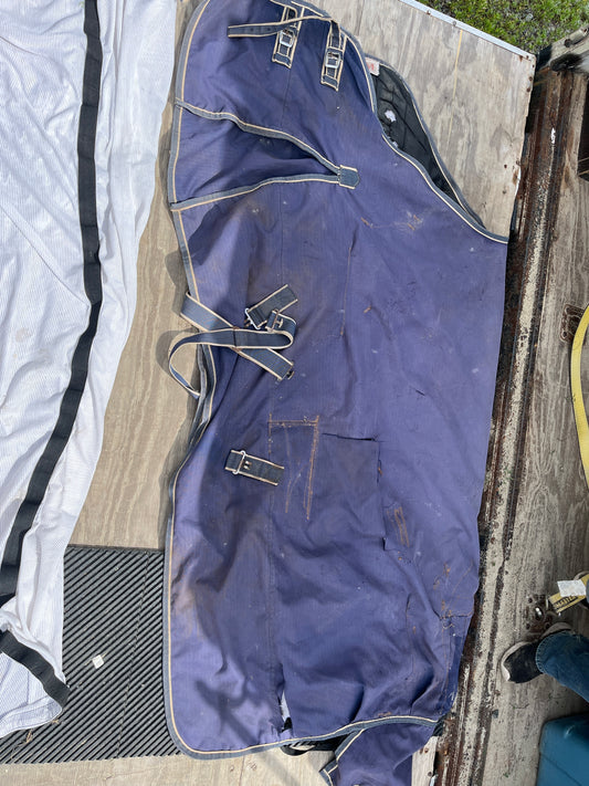 Medium turnout has rips as seen repairable