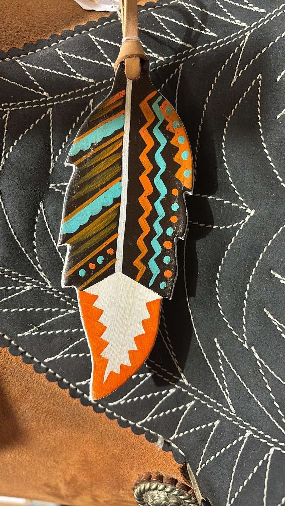 Feather saddle charm