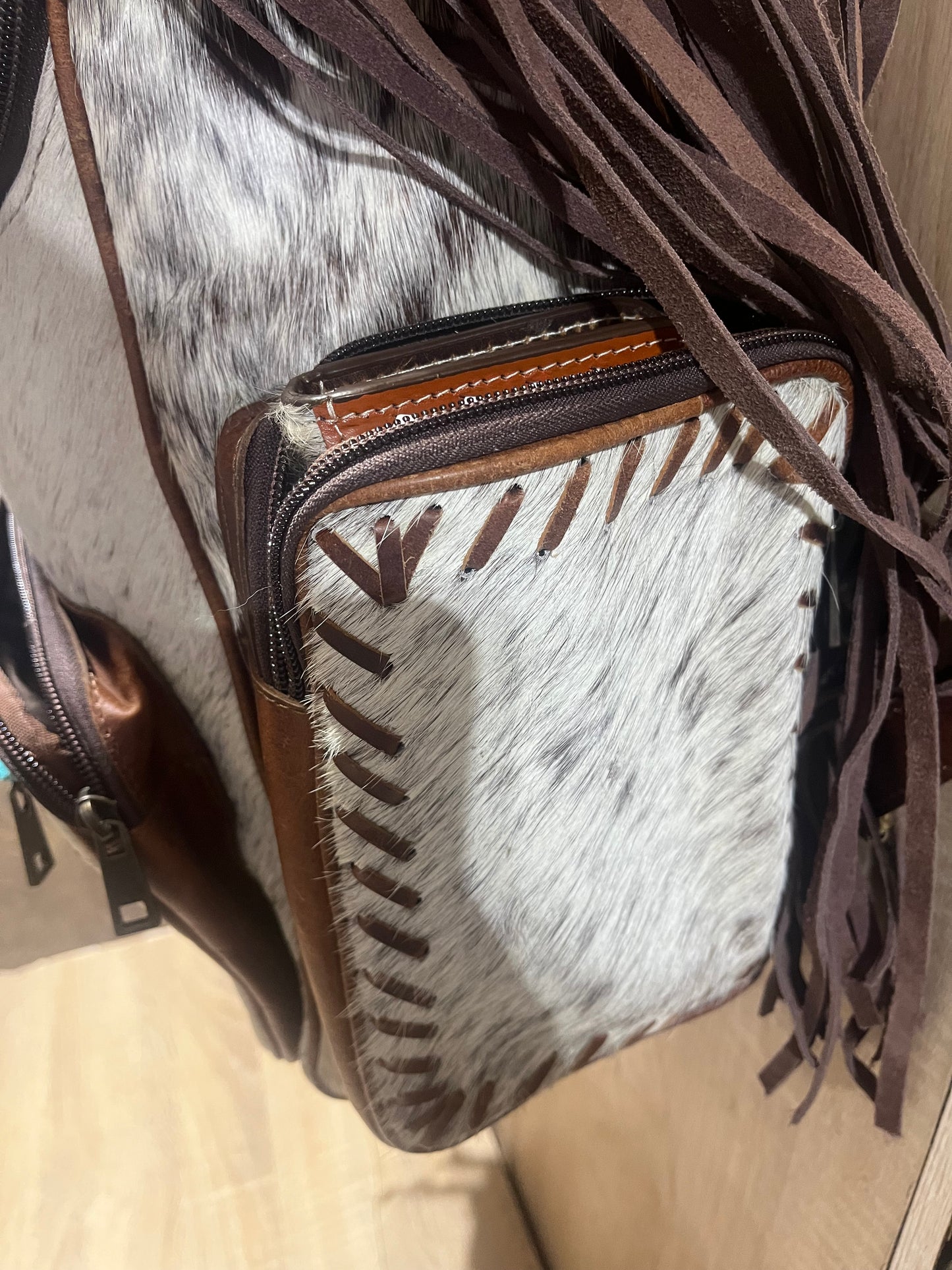Hair on cowhide backpack