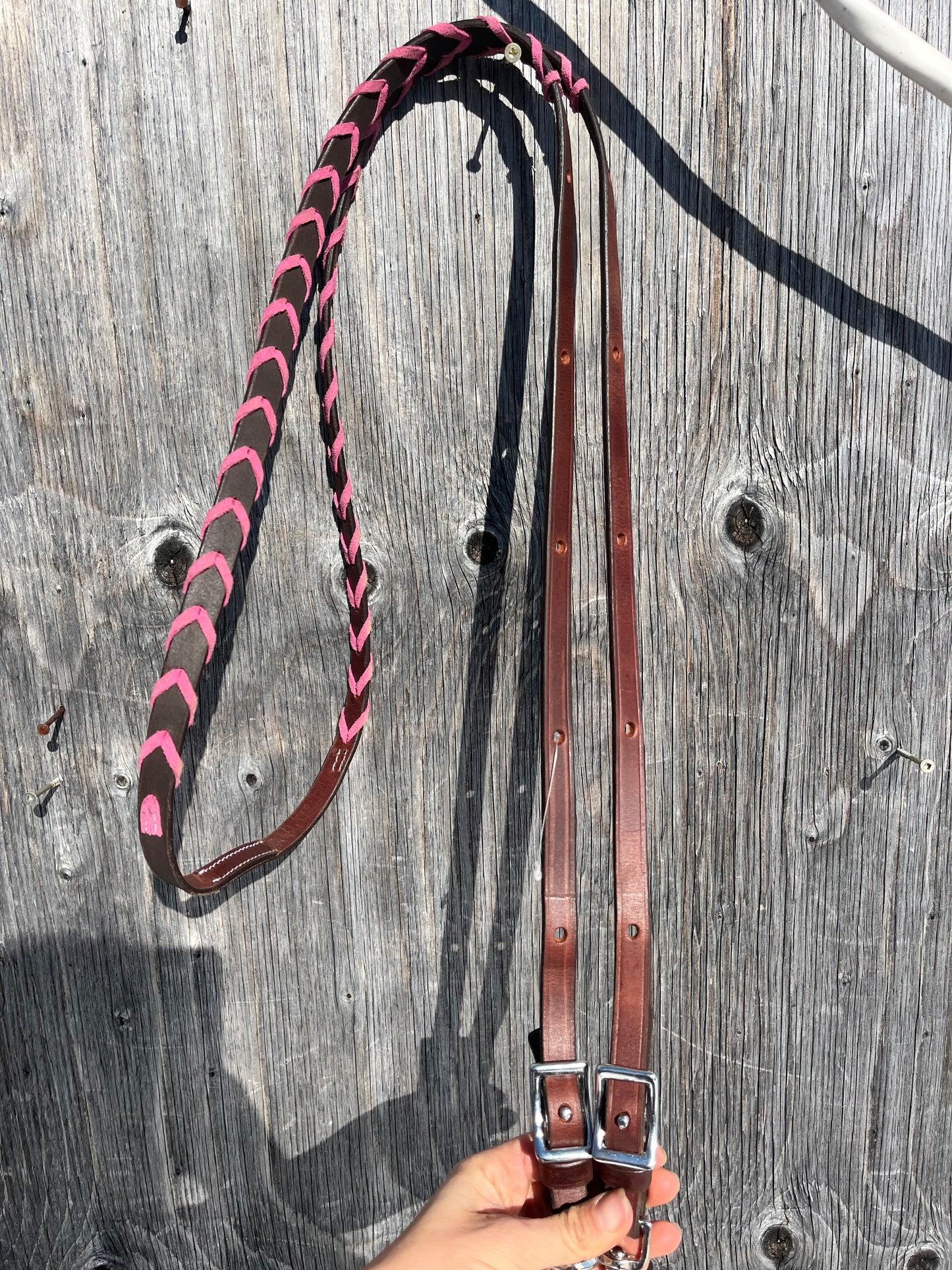 Pink laced adjustable barrel reins 7’10 at longest point with 6 holes/ side to adjust