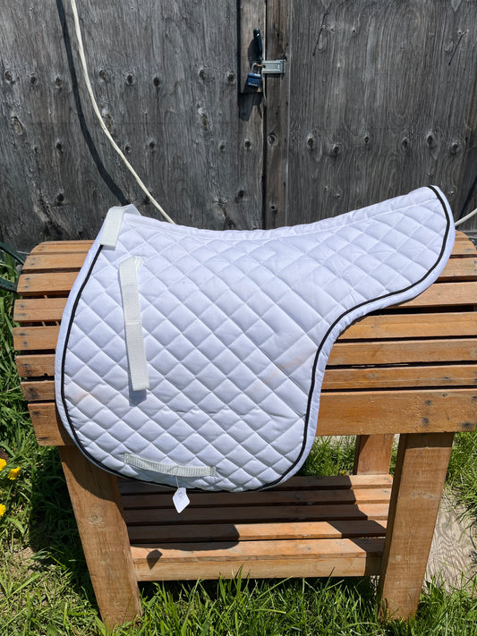 New shaped pad has tags but 2 small pink marks should come out in wash