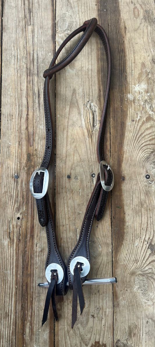 Supple leather rolled one ear slot concho ends