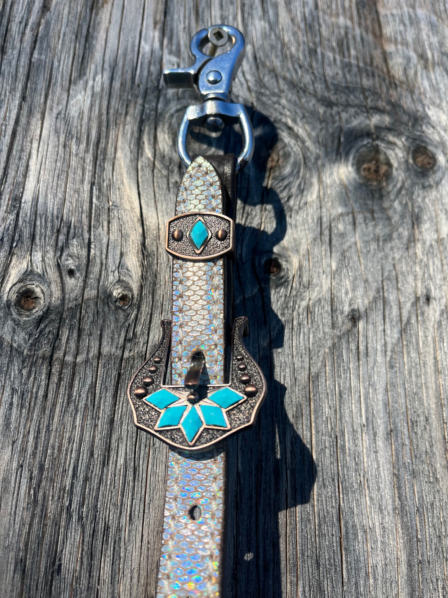Silver and teal wither strap
