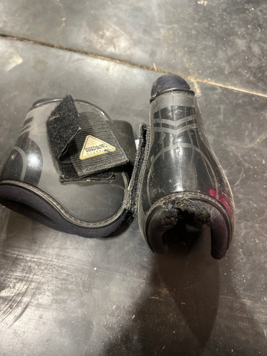 Fetlock boots have hole great for schooling
