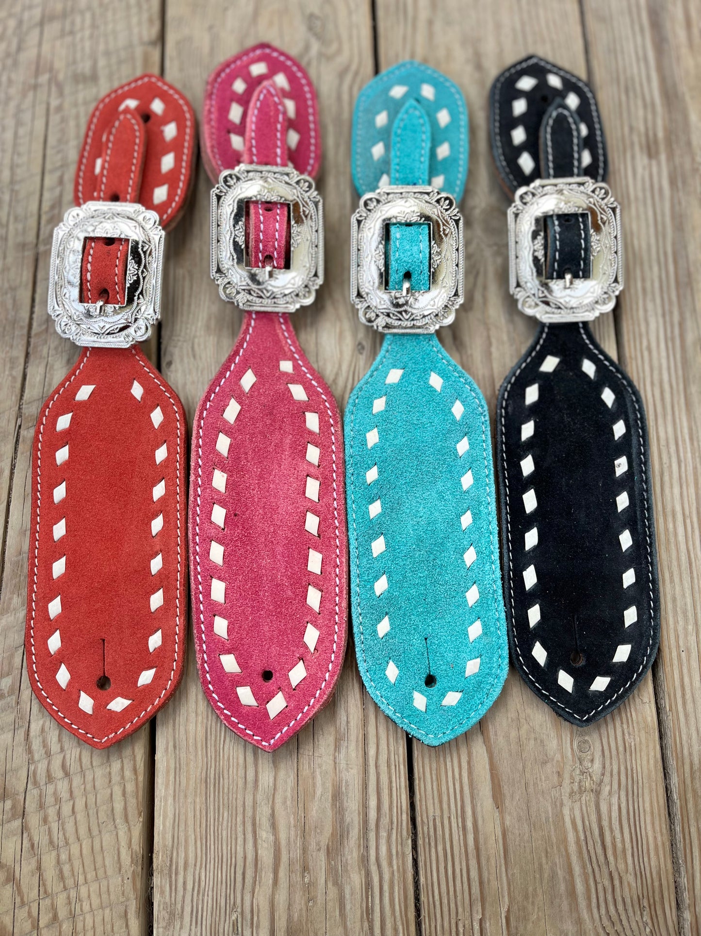 Coloured spur straps with buckstitch
