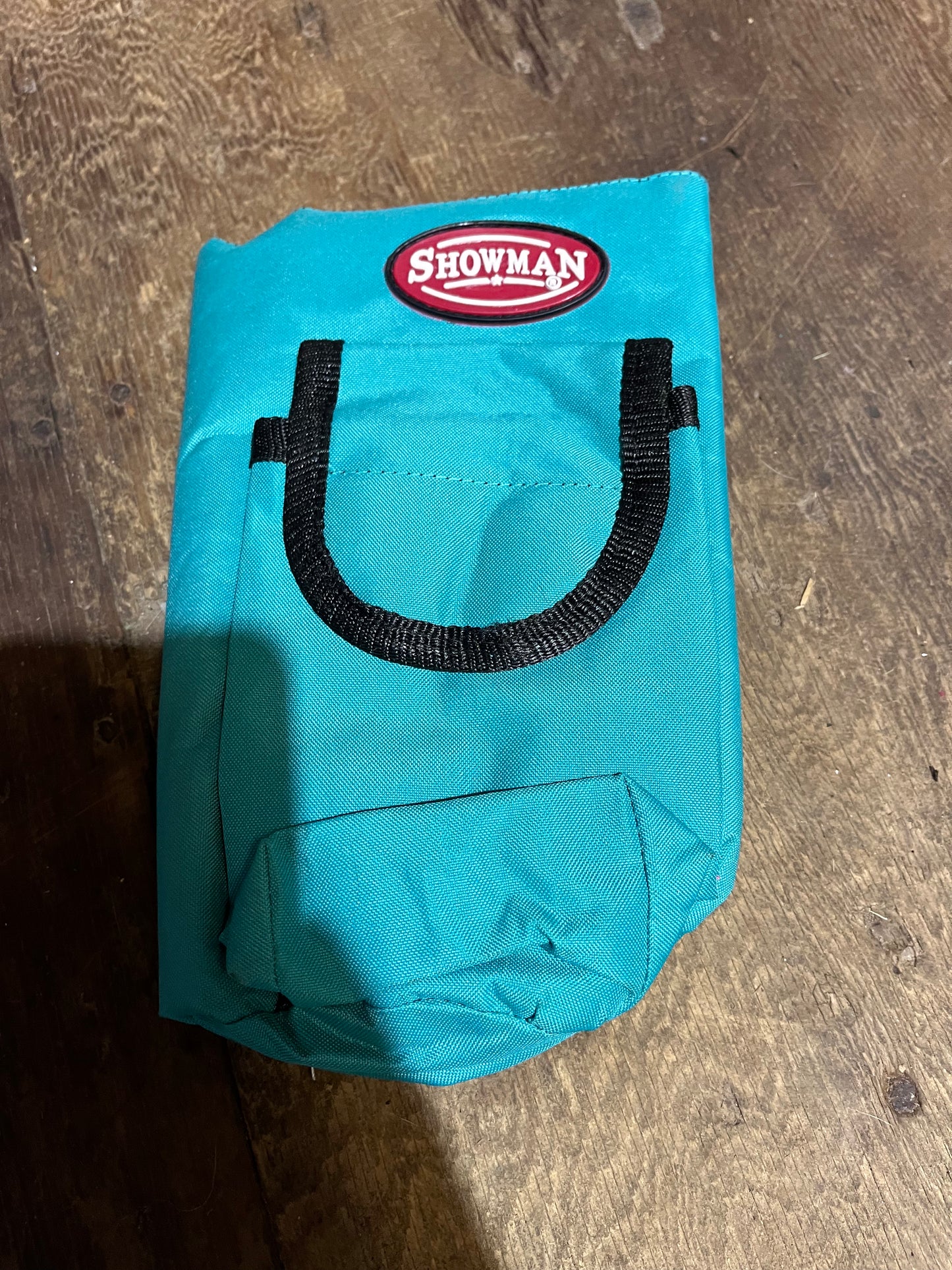 Teal water bottle holder for saddle
