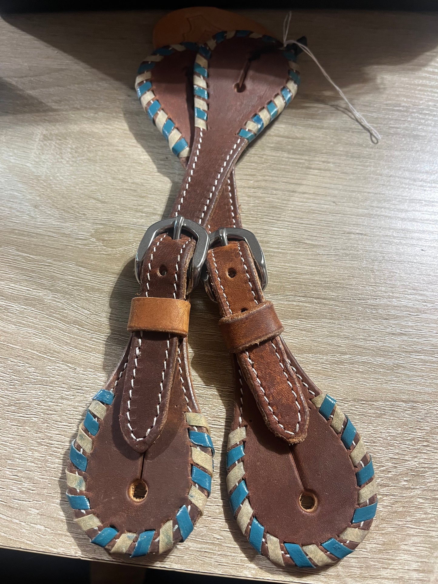 Turquoise rawhide laced spur straps