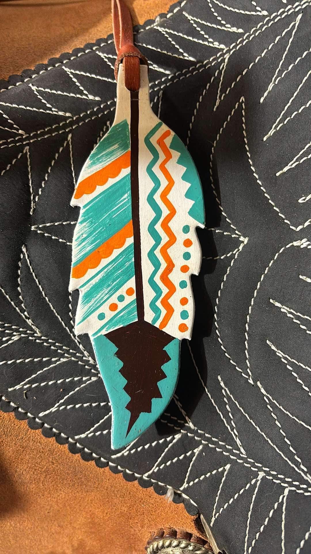 Feather saddle charm