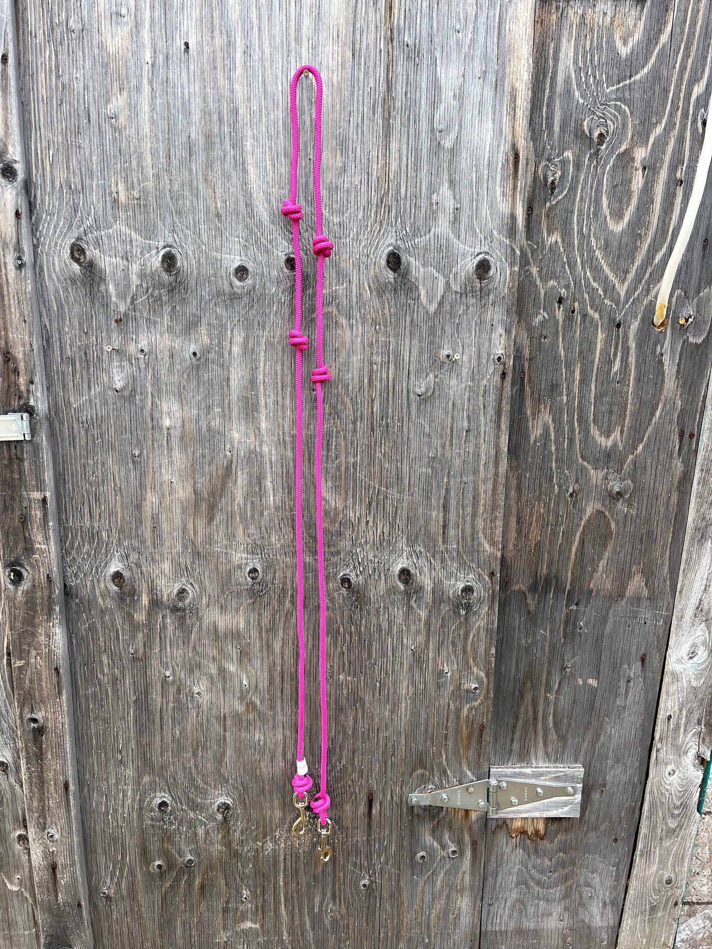 Pink knotted barrel reins with snaps