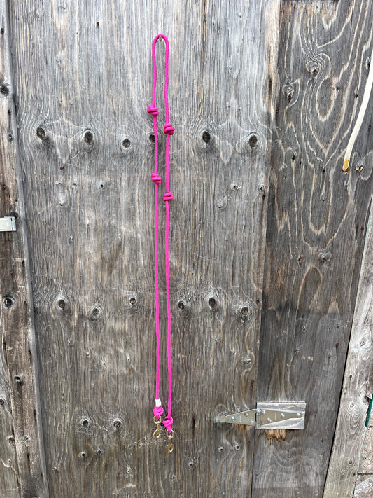 Pink knotted barrel reins with snaps