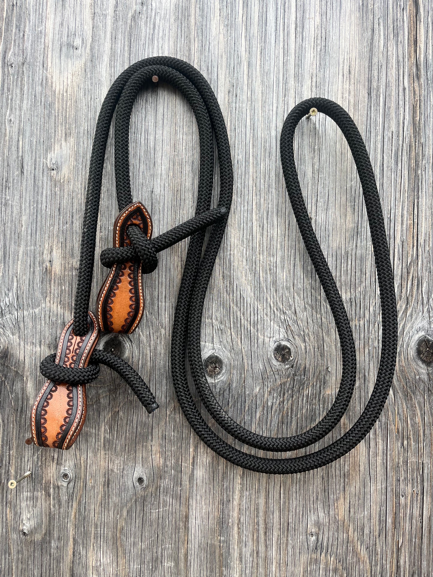Rolled black reins with slobber straps