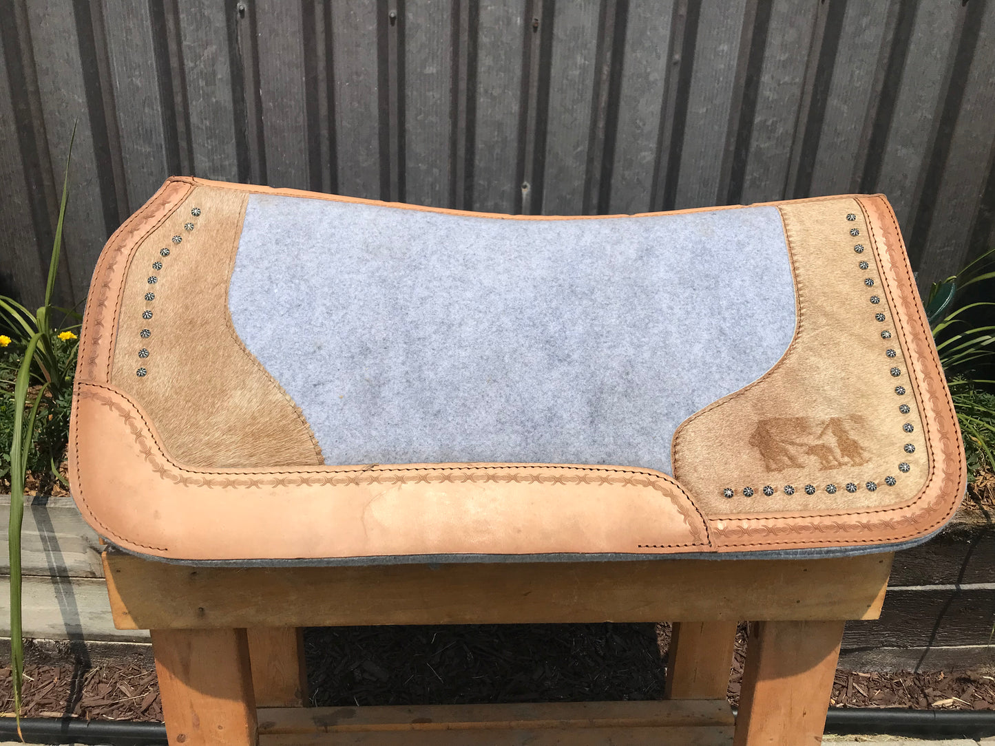 Hair on felt pad with roping riding embossed