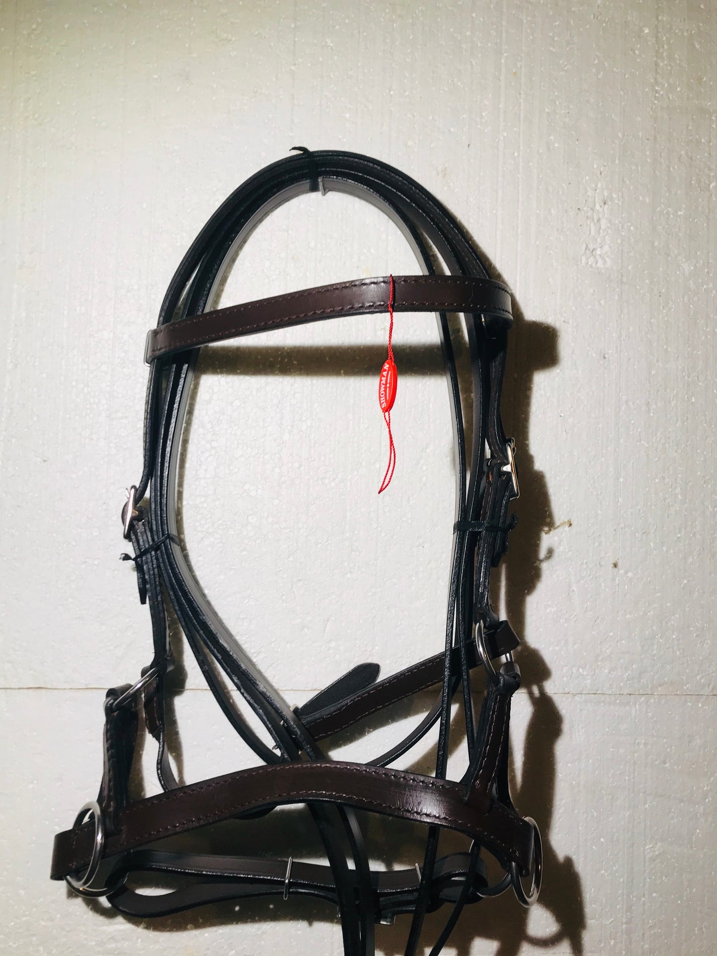 Brown leather bitless bridle with quick change reins