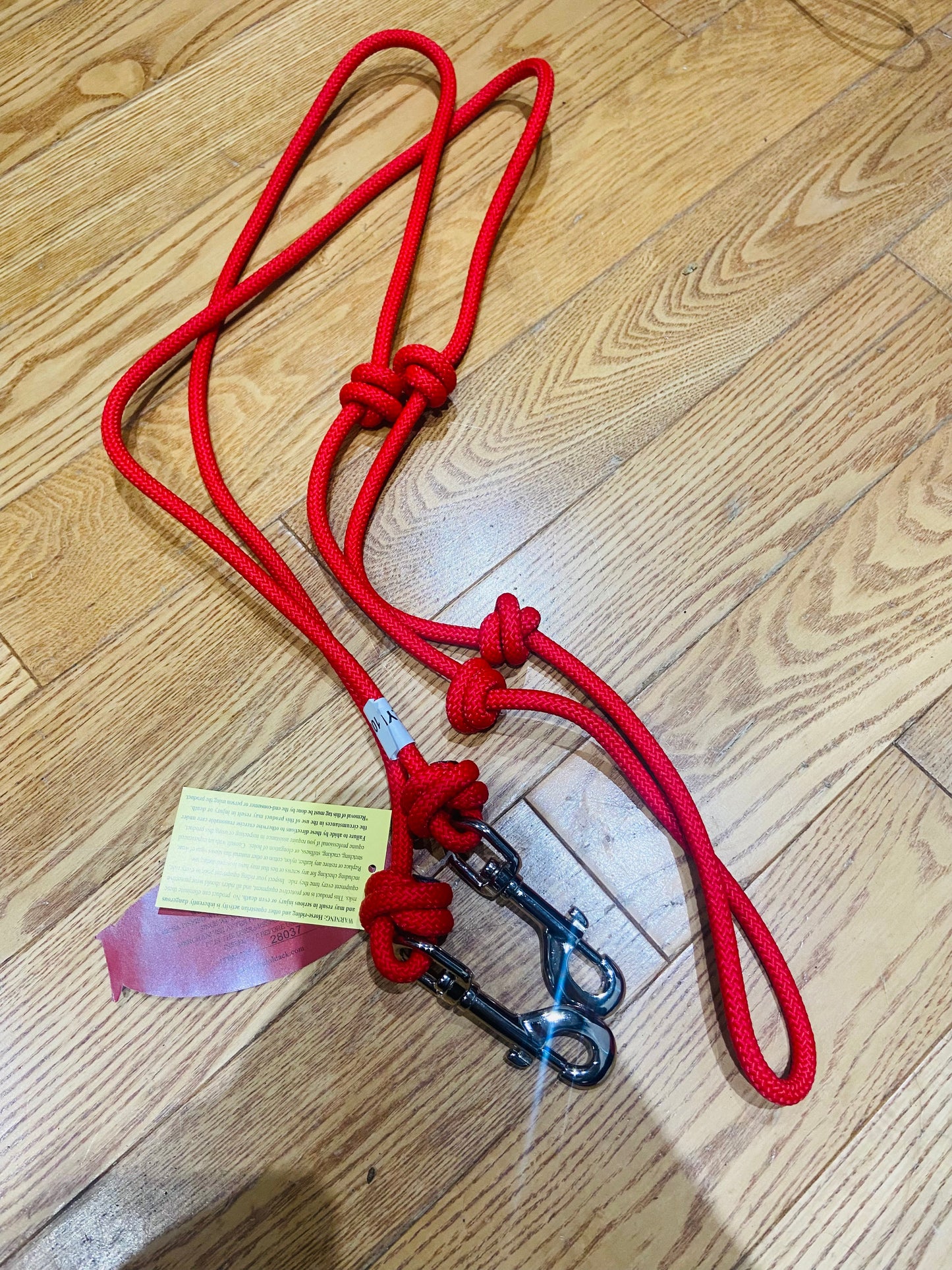Red barrel reins with snaps and knots
